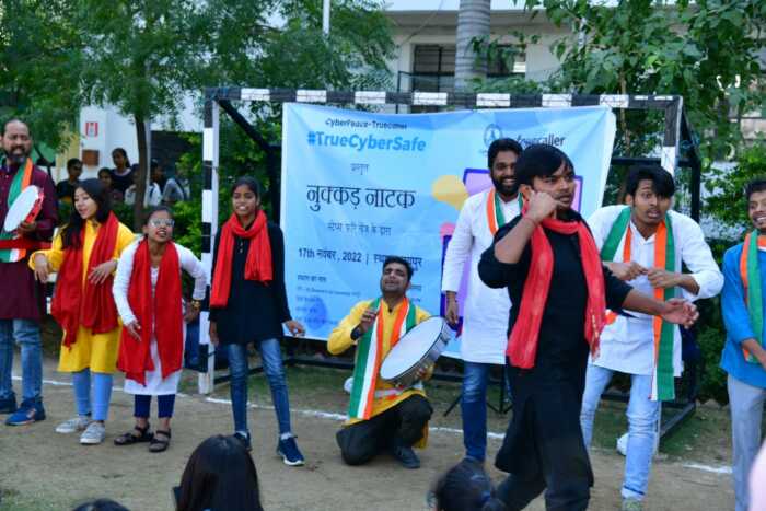 group of artists performing street play to educate students about cyber safety